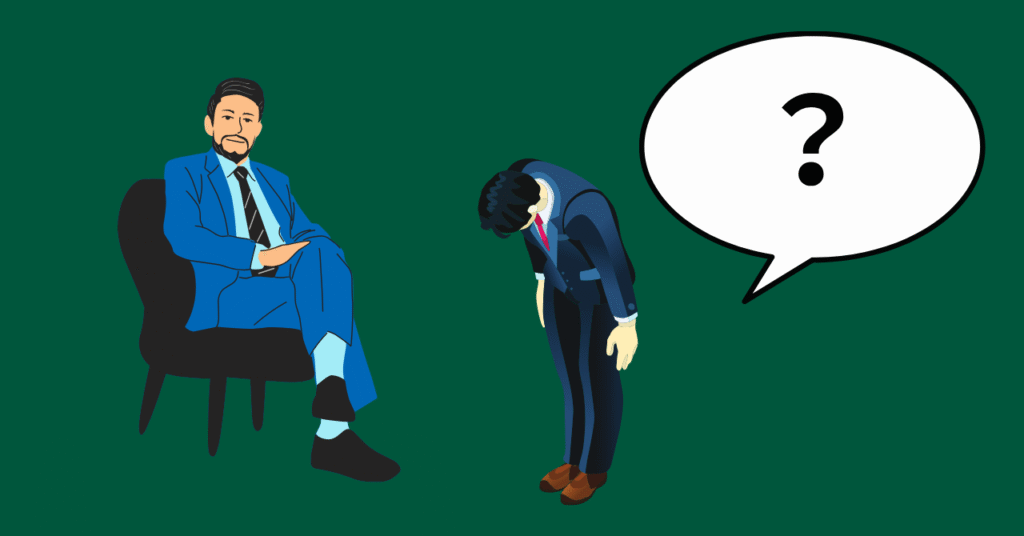 上司に頭を下げている人の画像